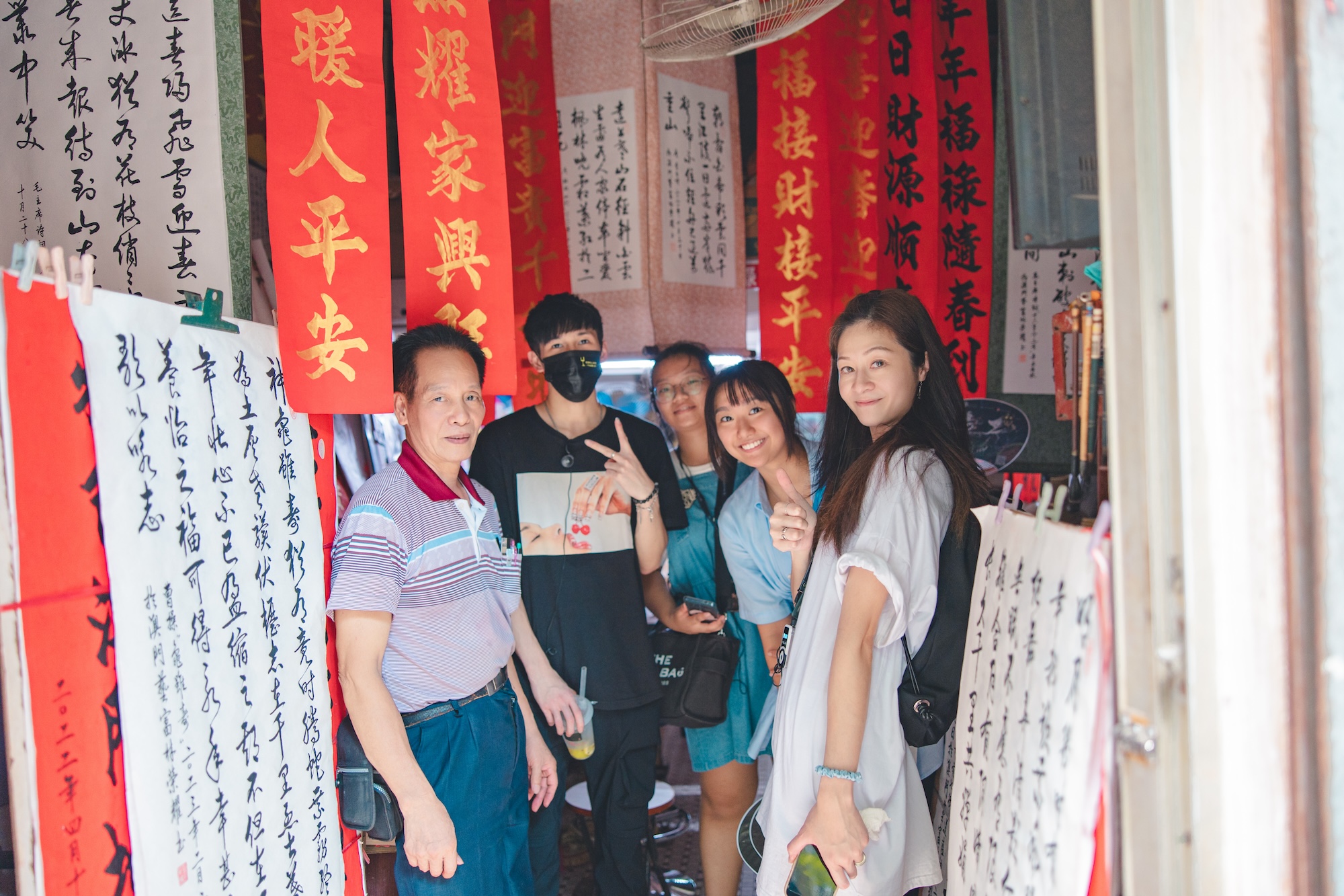 Master typographer Lam Weng Io show the tour group his exquisite calligraphy