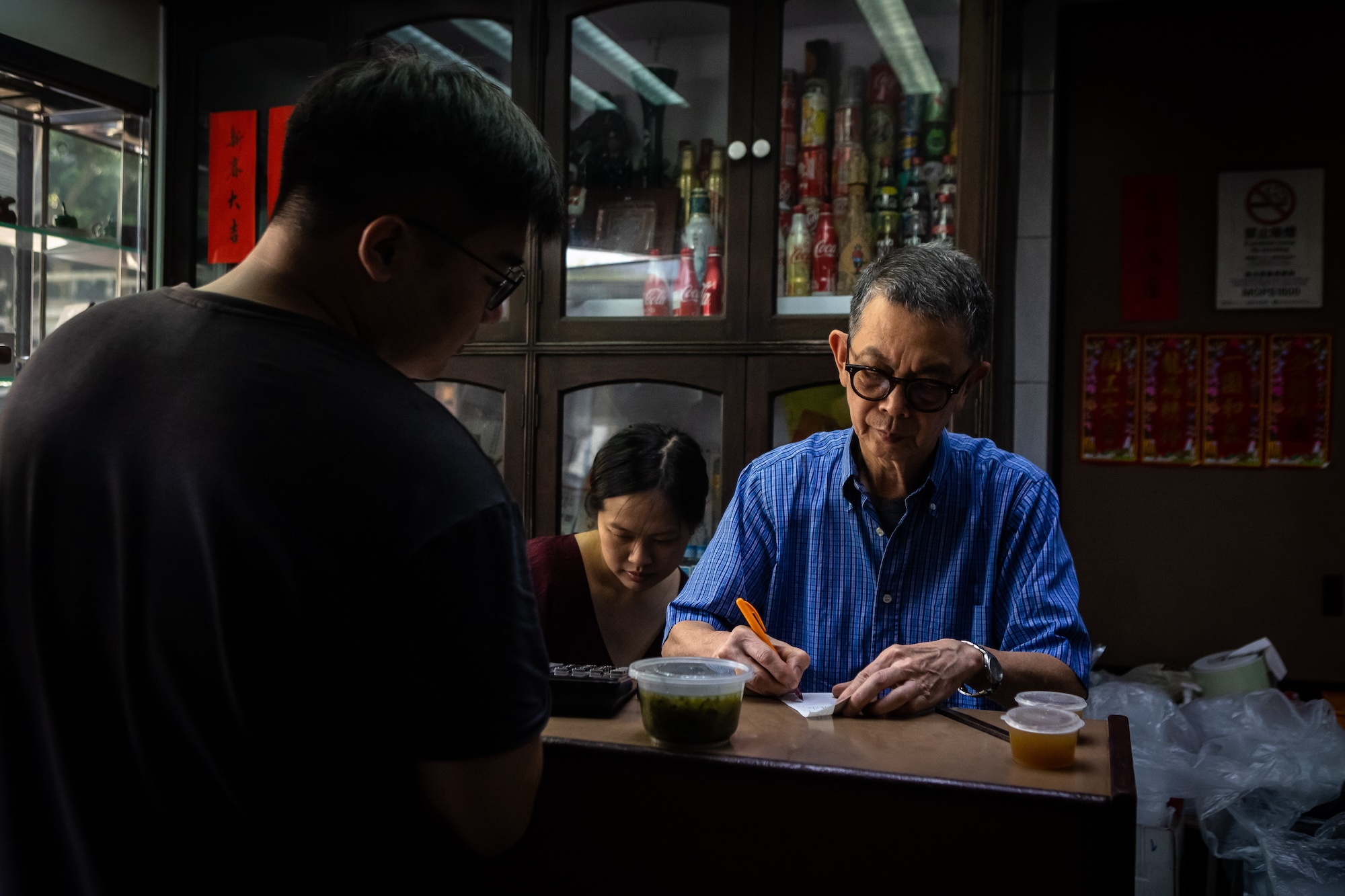 Lam Kok Veng puts in a final shift at the cashier’s desk, where he has been a familiar sight for years