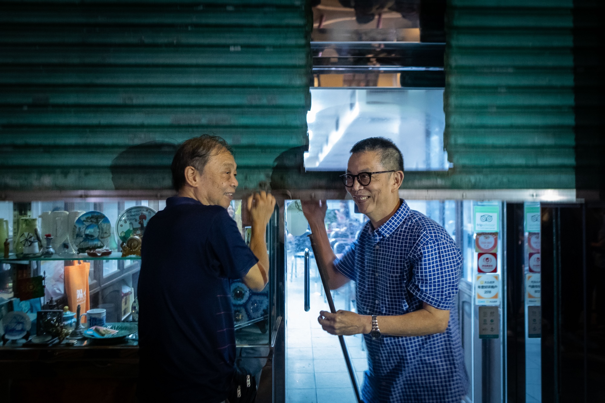 The Lam brothers can’t resist cracking a smile as they pull down the shutters for a last time and think of their well earned retirement ahead