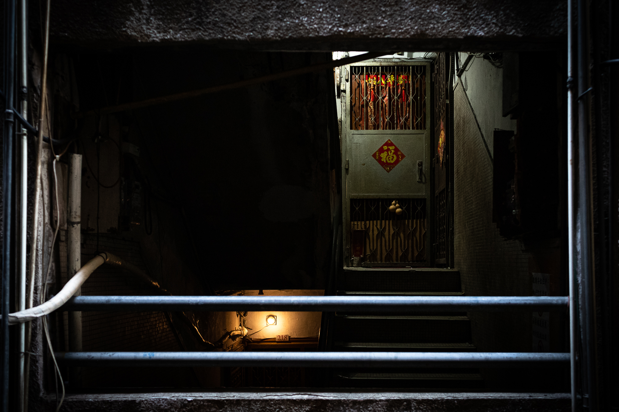 The door of an apartment at the Iao Hon tenement in northern Macao. Built during the 1960s, the apartment block has, according to 2021 data, 12,014 residents. That’s an average of more than 5 people per flat, compared to the city-wide average of 3